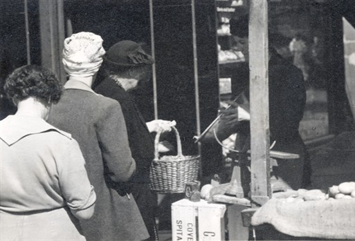 Photo:women shoppers queueing at a greengrocers in Harrow Road, c1955]